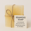 Bar of Seamos soap with a label on a beige background